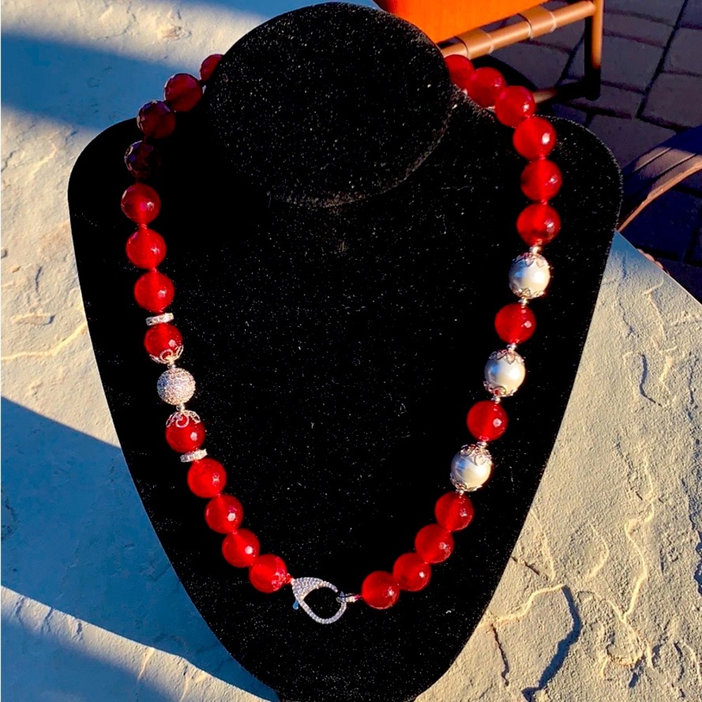 18” red quartz necklace with 3 cultured Tahitian pearls and marcasite bead.